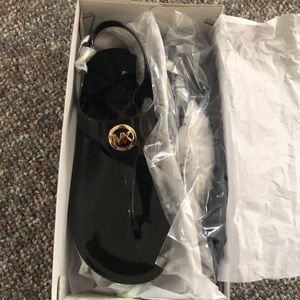 MK black jelly sandals